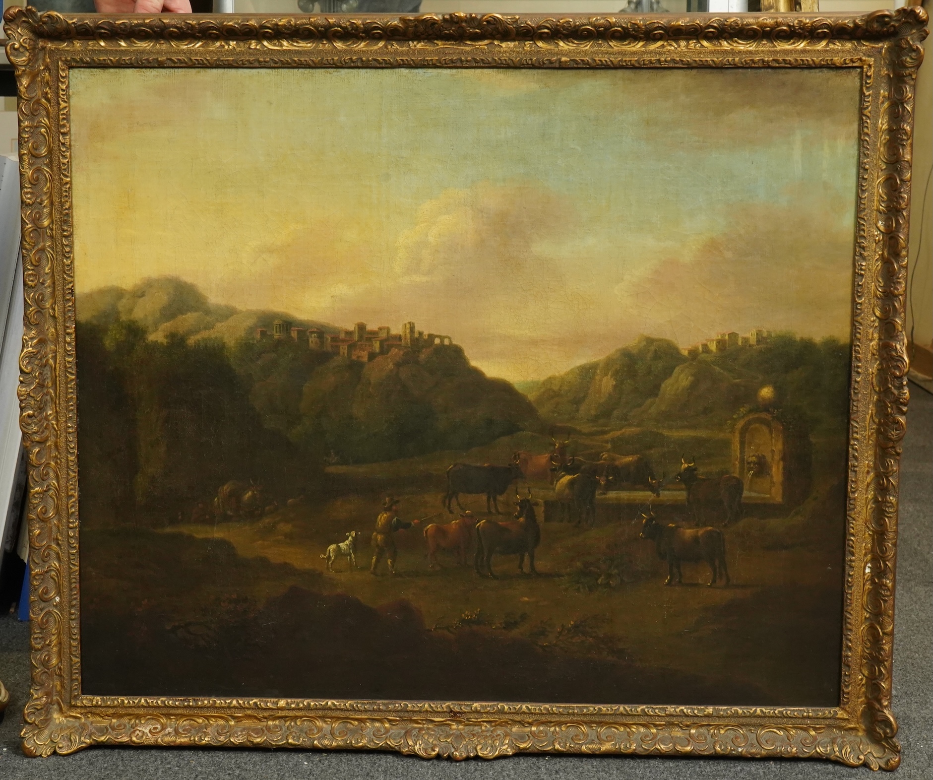 18th century Flemish School , Italianate landscape with cattle drover beside a fountain, oil on canvas, 62 x 75cm